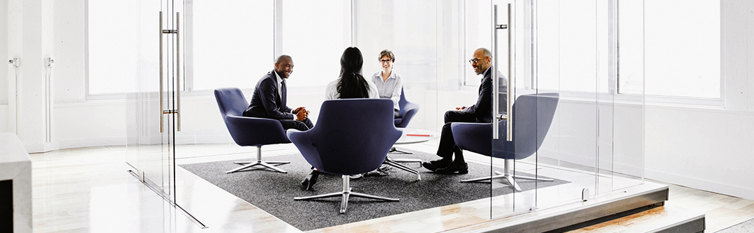 4 people sitting around a table