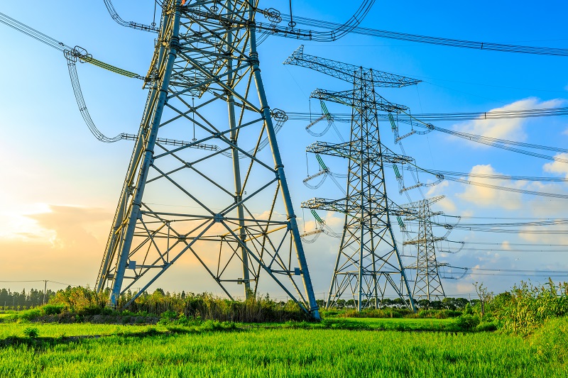 High power transmission lines at sunrise