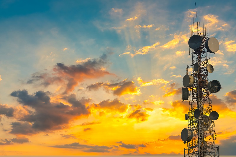 telecommunication tower at sunset with sky background