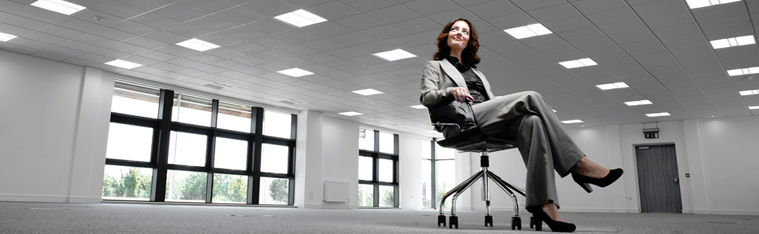 Woman sitting in a chair in the middle of a room